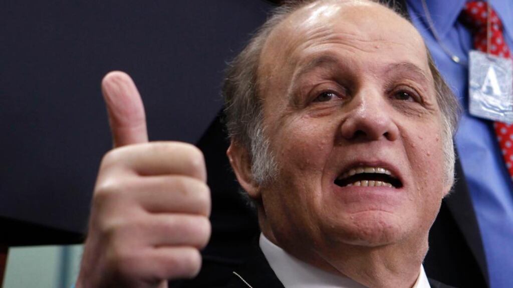 Former White House press secretary James Brady gives a thumbs-up to everyone as he visits the White House press briefing room in Washington in this 2011 file photograph.