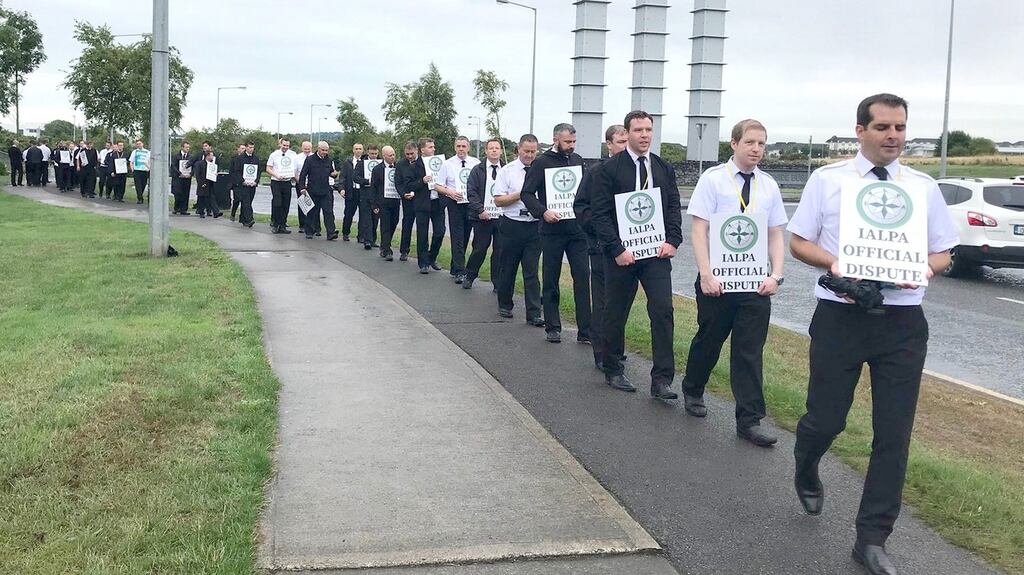 Irish Ryanair pilots outside the company headquarters at Swords in Dublin. Buyers (employers) and sellers (workers)  often hold different views over how much work effort and of what sort is satisfactory. Photograph:  Aoife Moore/PA