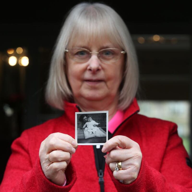 Joyce McSharry holding a photograph of her with her birth mother. Photograph: Laura Hutton