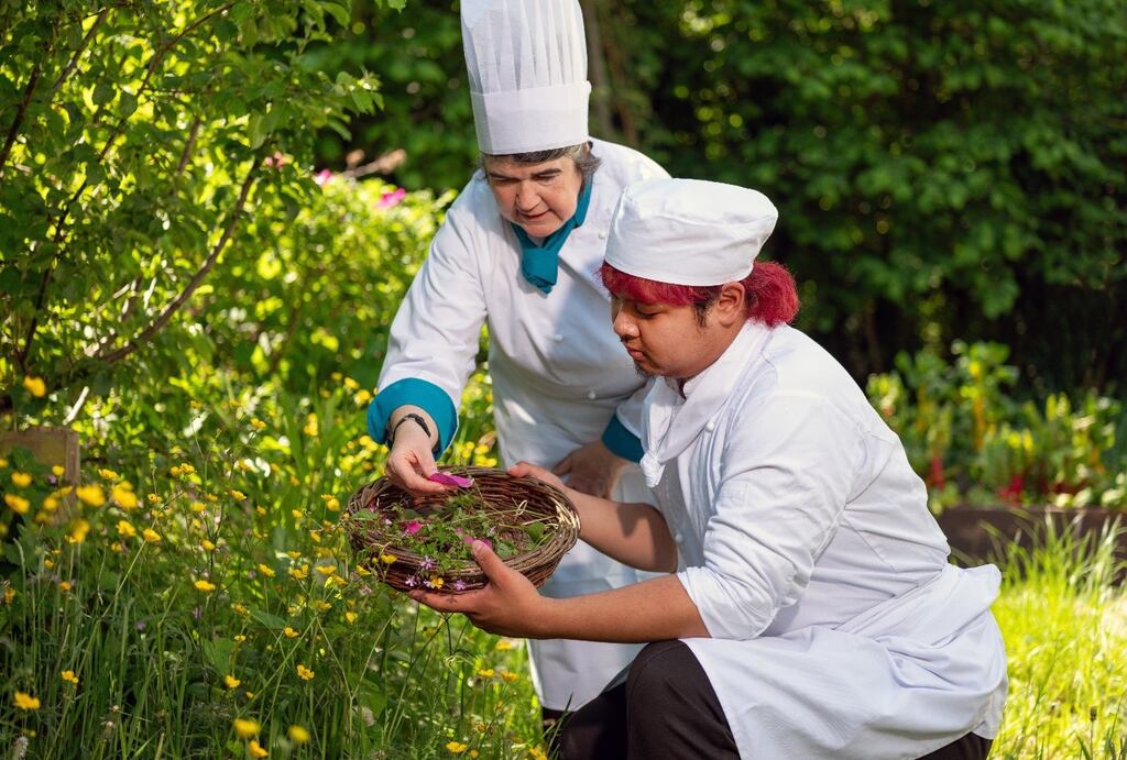 Annette Sweeney, lecturer in culinary arts, and BA culinary arts year three student Carlos Palieo foraging wild plants in the gardens of Airfield Estate in Dundrum, Co Dublin
