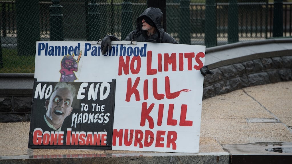 Abortion protest: a demonstrator outside the US supreme court as it heard a challenge to a California law requiring pregnancy clinics to distribute information on family-planning services. Photograph: Nicholas Kamm/AFP/Getty