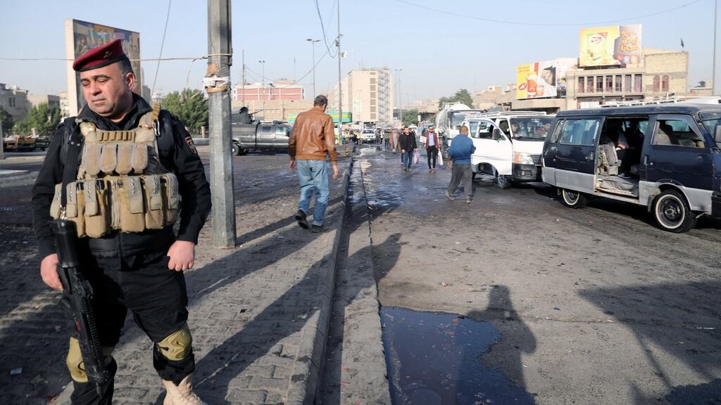 An Iraqi policeman stands near the site of a suicide bomb attack at Tayaran square in central Baghdad, Iraq, 15th January 2018. Photograph: Ali Abas/EPA