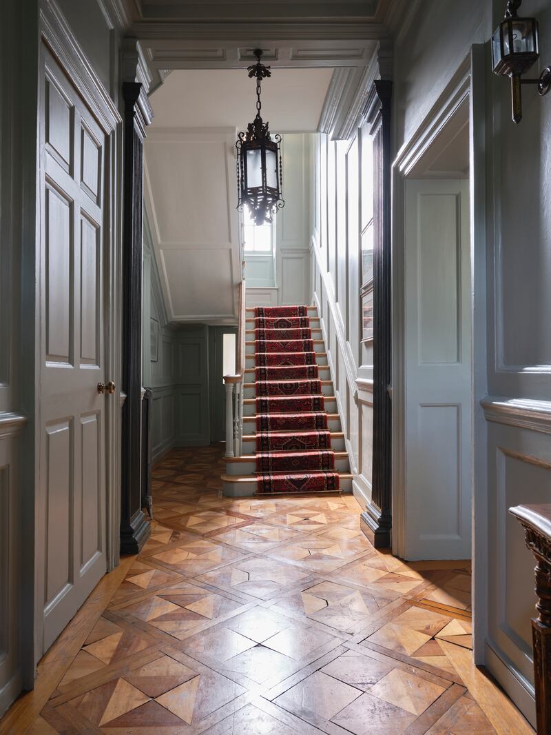 Hall: Parquet flooring, not original to the house but made from an assortment of reclaimed timbers. Panelling has been restored by the owners.