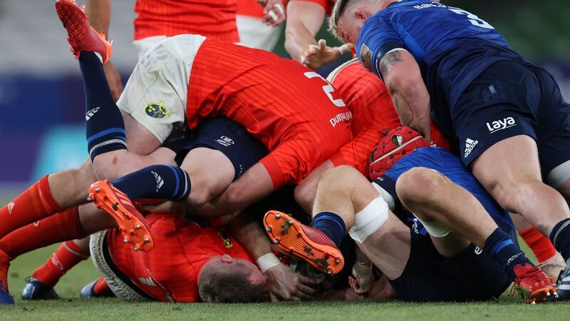 Chris Farrell is tackled as Andrew Porter looks to clear out during Leinster’s win over Munster. Photograph: Billy Stickland/Inpho