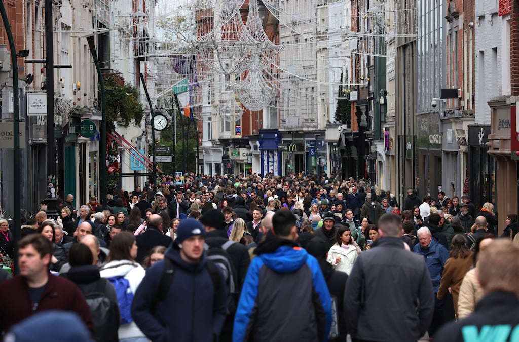 Christmas shoppers on Grafton Street. Just over half of respondents to a survey are feeling negative about living in Ireland in the year ahead, a drop from 56 per cent this time last year and 61 per cent two years ago. Photograph: Dara Mac Dónaill/The Irish Times