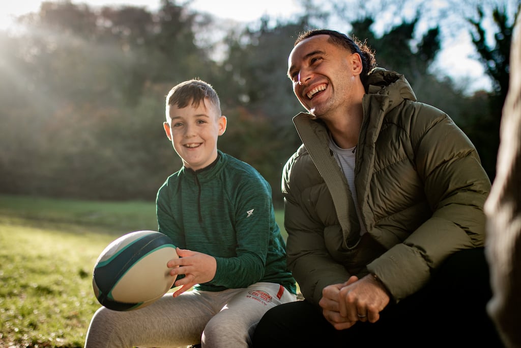 Adam McCarthy and James Lowe. In an outtake of the Arthritis Ireland video, the Cork schoolboy couldn't resist asking if James might ever play for Munster. “There is no chance that I will ever have a Munster jersey on I am afraid,” replies the Leinster winger, who laughingly adds, in response to Adam’s offer of a bribe: “No, a packet of biscuits is not going to get me over the line.”
