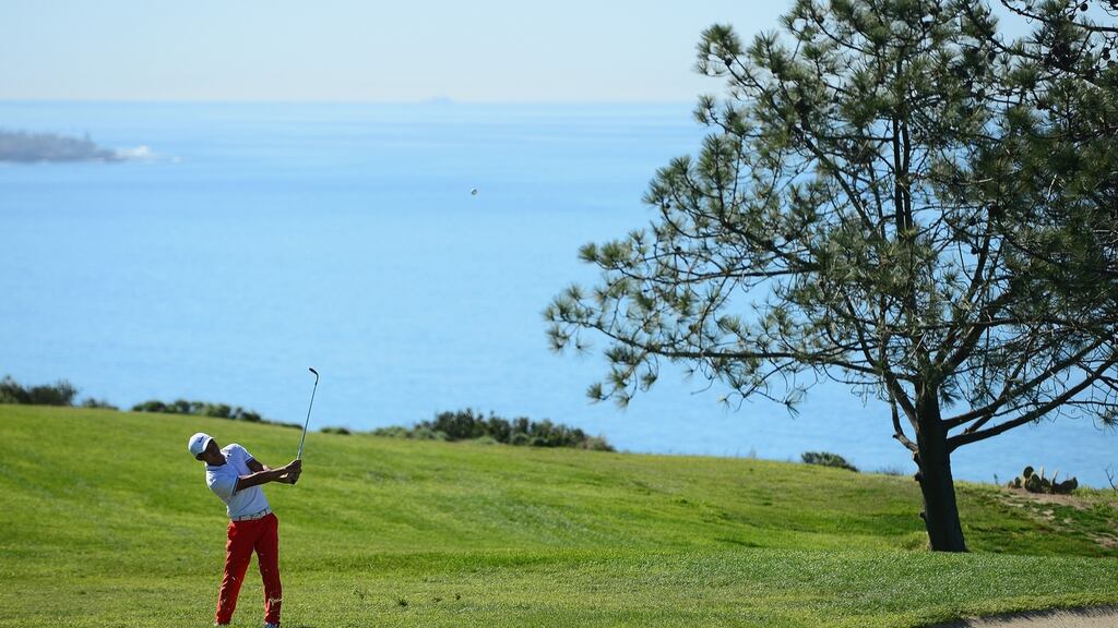 Cheng Tsung Pan of Taiwan plays his shot on the fourth hole during the final round of the Farmers Insurance Open at Torrey Pines South in San Diego, California. Photo: Donald Miralle/Getty Images