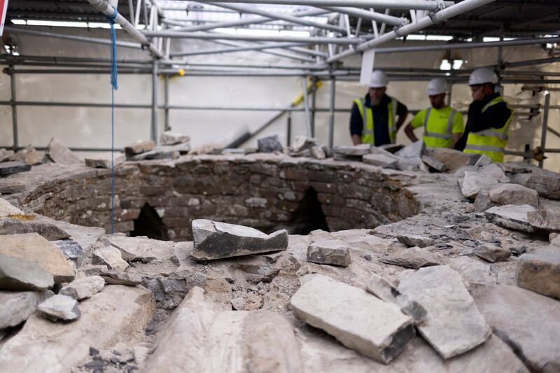Crew examine the top of tower
