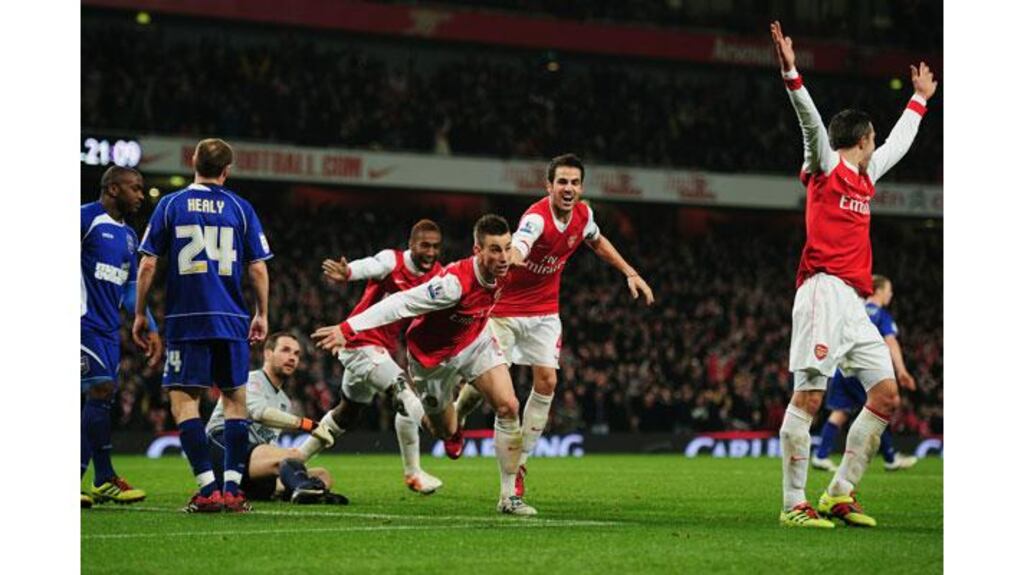 Arsenal's Laurent Koscielny (C) celebrates as he scores one of three goals to deny Ipswich in the League Cup Semi-final Second Leg at the Emirates Stadium. Photograph: Shaun Botterill/Getty Images)