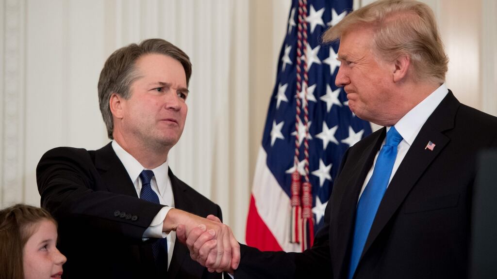 Judge Brett Kavanaugh shakes hands with President Donald Trump after being nominated to the US supreme court in the East Room of the White House on Monday. Photograph: Saul Loeb/AFP/Getty Images