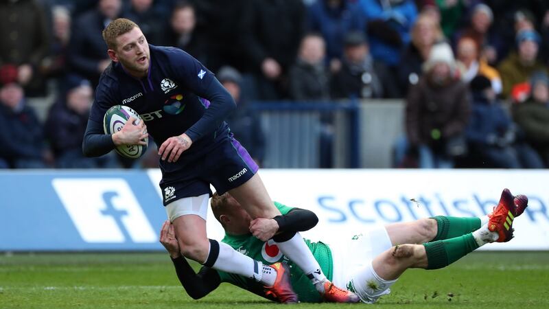 Finn Russell is tackled by Keith Earls during Ireland’s win over Scotland at Murrayfield in February. Photograph: Billy Stickland/Inpho