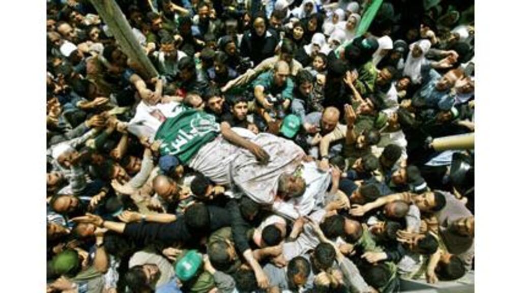 Supporters carry the coffin of assassinated Hamas leader Abdel-Aziz al-Rantissi during his funeral in Gaza City yesterday.