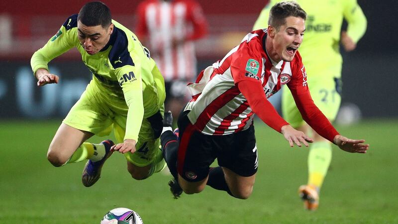 Newcastle United’s Miguel Almiron collides with Brentford’s Sergi Canos during the Carabao Cup quarter-final against Newcastle at the Brentford community stadium in London. Photograph: Hannah McKay/AFP via Getty Images
