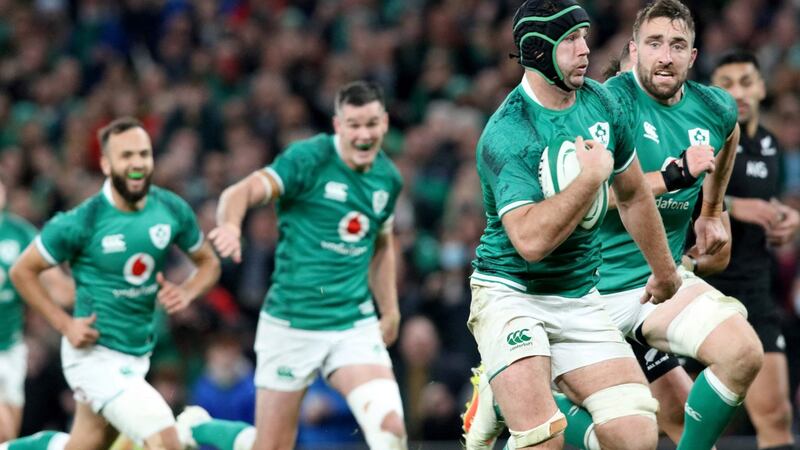 Caelan Doris runs away from the New Zealand defence to score Ireland’s third try during the game against New Zealand. Photograph: Paul Faith/AFP via Getty Images