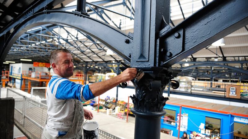 Painting of roof girders at the fruit and vegetable market on Mary’s Lane by Derek Douglas back in 2013. Photograph: Aidan Crawley