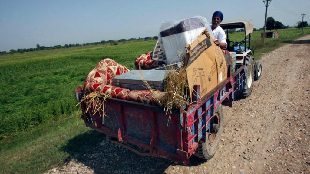 A man with his belongings on a tractor cart moves to a safer place at Jagowal village near Jammu on Thursday. India warned Pakistan it would pay an “unaffordable price” if it persisted with shelling and machine-gun fire across a heavily populated border area in the lowlands of Kashmir. Photograph: Mukesh Gupta/Reuters