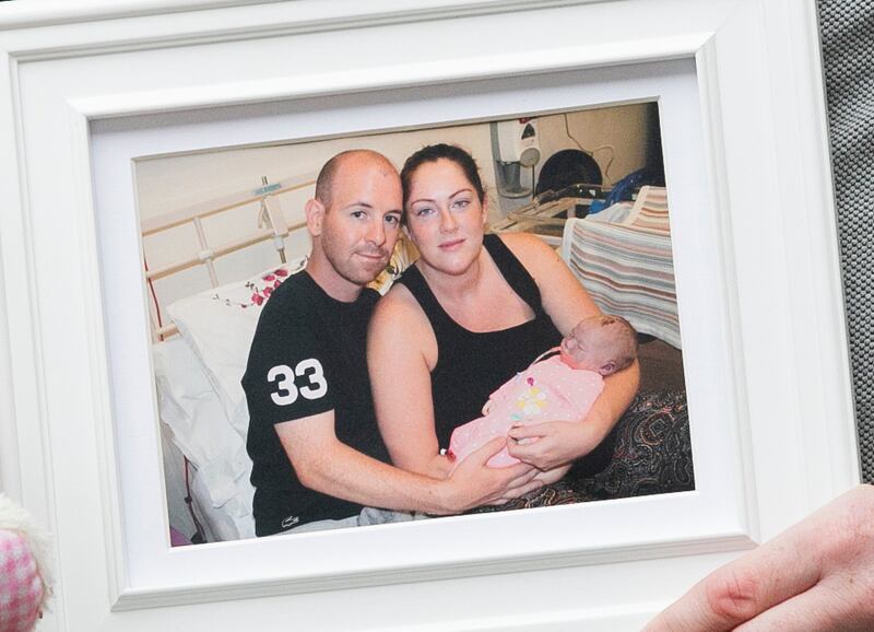 Parents of Molly McEvoy, Joe McEvoy and Gemma McEvoy, with their daughter. Photo: Gareth Chaney/Collins