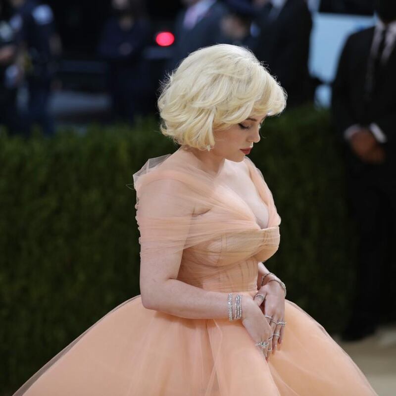 Billie Eilish in her full-princess Oscar de la Renta dress, a departure from her normal red-carpet look of androgynous oversize matching sets