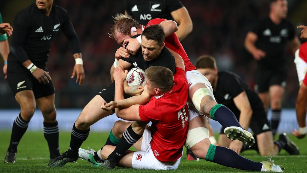 Ben Smith of the All Blacks is tackled by Lions duo Alun Wyn Jones and Owen Farrell during the first Test at Eden Park. Photograph: Hannah Peters/Getty Images