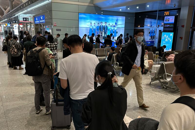 Passengers prepare to board a flight at the airport in north-central China’s Jiangxi province. Photograph: Ng Han Guan/PA