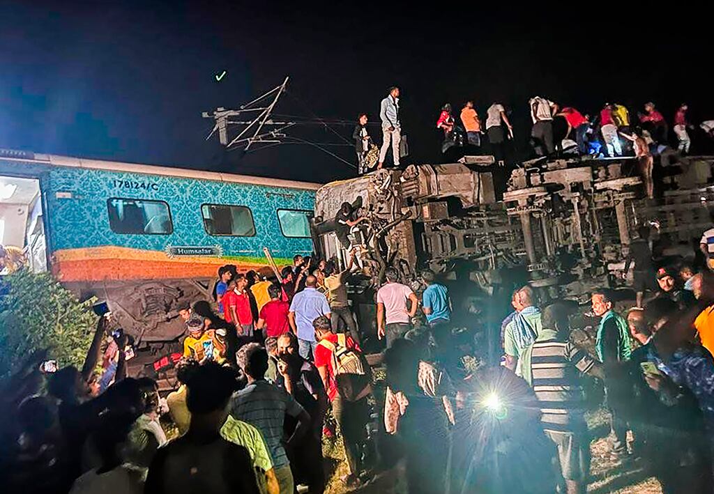 Rescuers at the site of the rail crash in Odisha. Photograph: Press Trust of India/AP