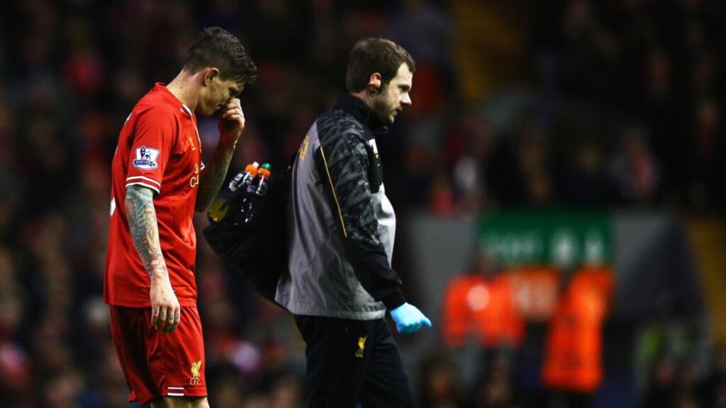 LDaniel Agger goes off to receive treatment during the FA Cup third round match between Liverpool and Oldham on January 5th. Photograph: Clive Mason/Getty Images