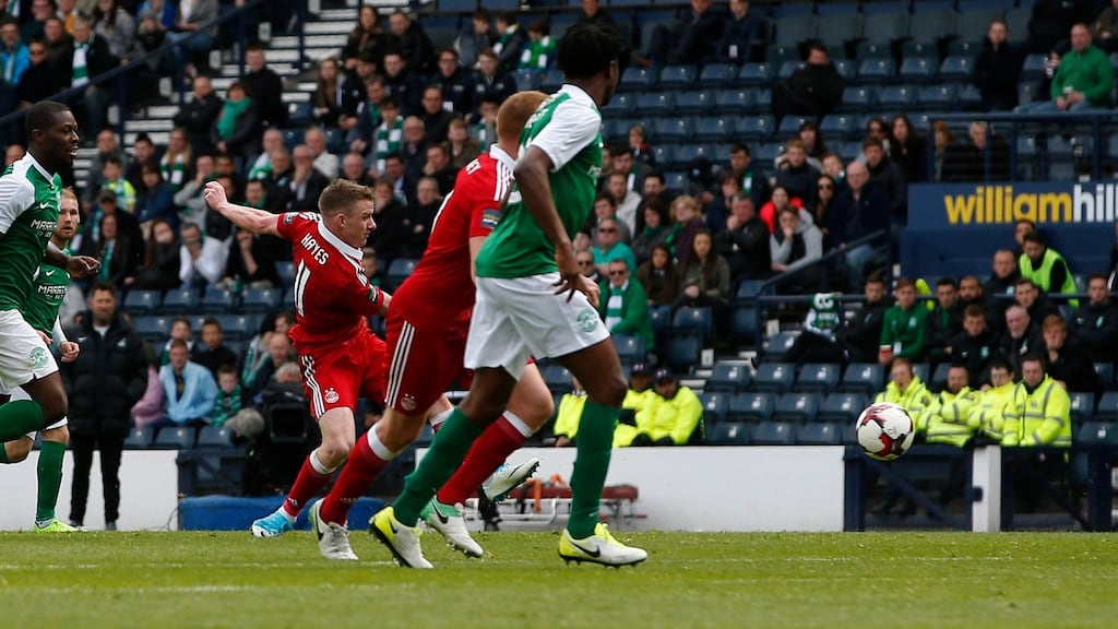 Jonathan Hayes scores Aberdeen’s third goal with a deflected shot off Hibernian’s Darren McGregor in the Scottish Cup semi-final at Hampden Park in Glasgow. Photograph: Craig Brough/Action Images via Reuters/Livepic