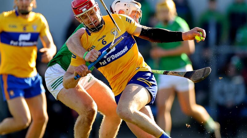 Clare’s John Conlon's hurl is broken as he is tackled by Limerick's Cian Lynch during the the drawn league clash at Cusack Park, Ennis. Photograph: James Crombie/Inpho