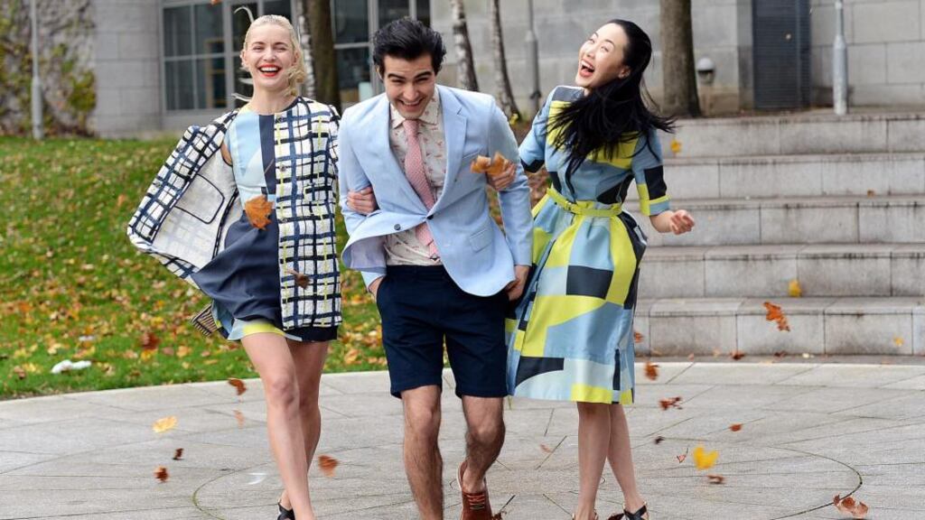 Models Teo Sutra, Jonathan Zavala, and Yomiko Chen, are caught by a sudden gust of wind during a photocall to launch the Arnotts Spring Summer 2015 collections , in Dublin. Photograph: Eric Luke / The Irish Times