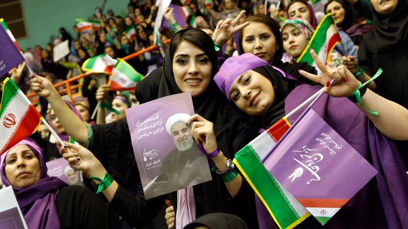 Supporters of Iranian president Hassan Rouhani: he and five other candidates are running in presidential elections in a country where millions run moneymaking schemes just to keep up and youth unemployment is at 30 per cent. Photograph: Abedin Taherkenareh/EPA