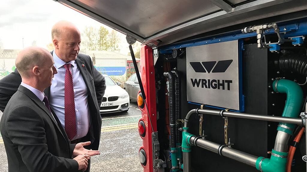 British transport secretary Chris Grayling with head of product development for low-emissions buses at Wrightbus, Jim Morrison, during a visit to the Wrightbus factory in Ballymena. Photograph: Department for Transport/PA Wire