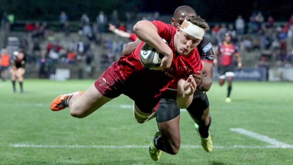 Munster’s Dan Goggin scores a try despite the efforts of Michael Makase of the Southern Kings during the Guinness Pro 14 game at Outeniqua Park in George, South Africa. Photograph: Dan Sheridan/Inpho