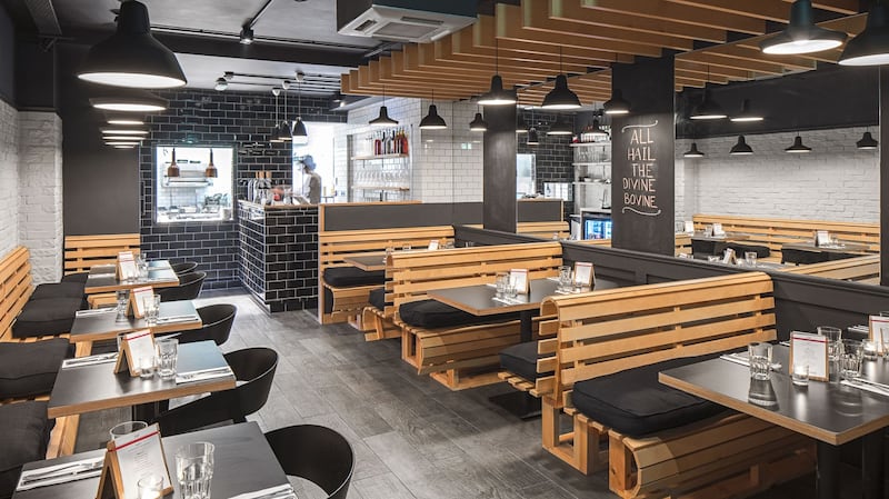 Featherblade: the seats are wooden slatted benches on to which someone has put chunky black cushions.