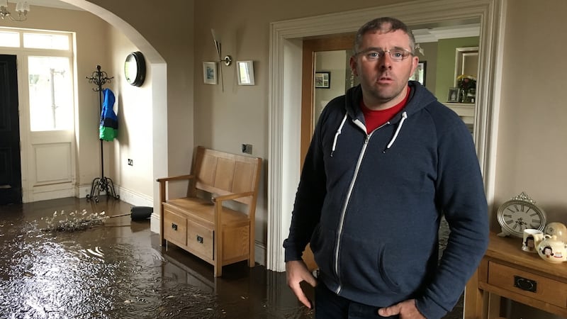 Paul Bradley in the hall of his flooded home, built on a floodplain of the Burnfoot river, in Donegal, August 2017. File photograph: Peter Murtagh/The Irish Times