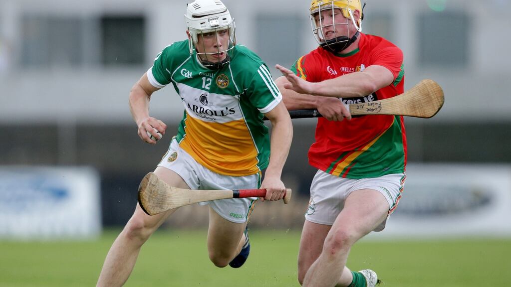 Carlow’s Conor Foley with Ronan Hughes of Offaly during the Leinster under-21 hurling championship semi-final. Photo: Tommy Dickson/Inpho
