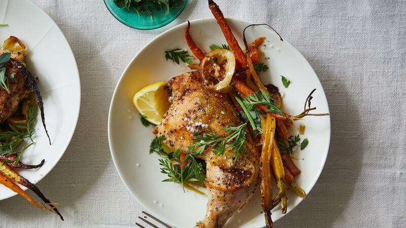 Olive oil-roasted chicken with caramelized carrots. Photograph: Michael Graydon and Nikole Herriott/The New York Times.