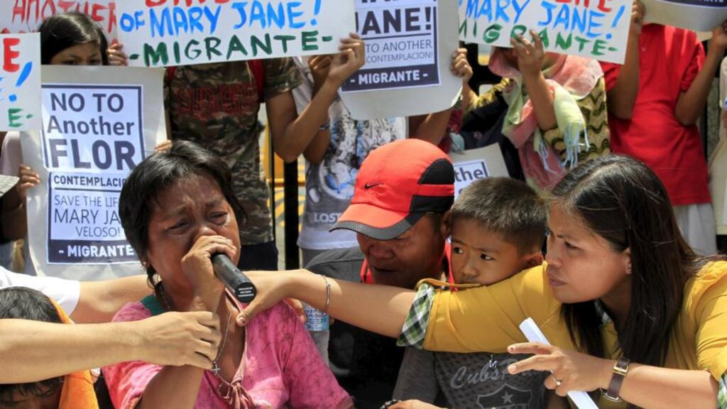 Celia Veloso, mother of Mary Jane Veloso, cries as she is comforted by family members, during a protest pleading President Benigno Aquino for help in her daughter’s case. Photograph: Romeo Ranoco/Reuters
