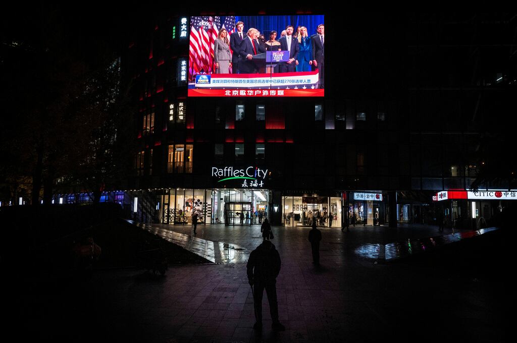 US president-elect Donald Trump is seen on a large screen at a shopping mall in Beijing, China. Photograph: Kevin Frayer/Getty Images
