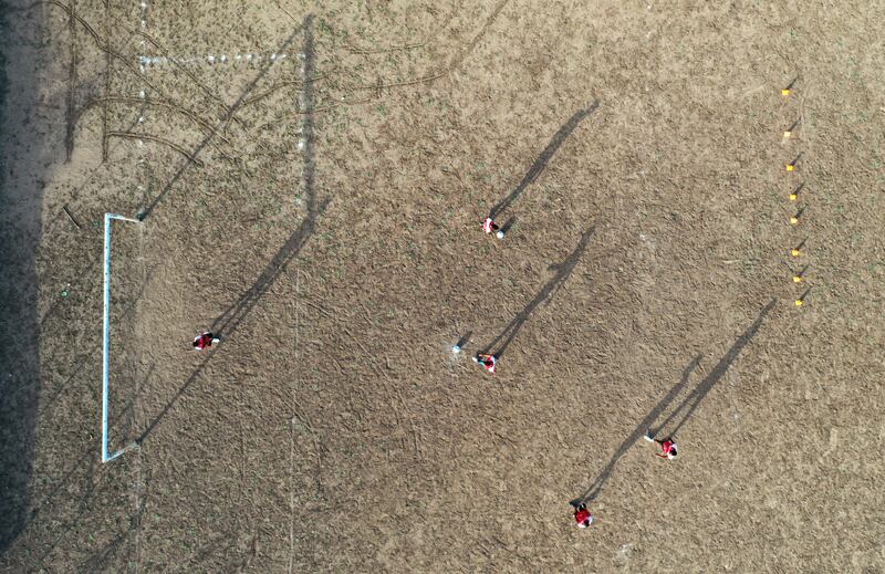 Children playing football on a dusty field in Barrancas, Guajira province, Colombia where Luis Diaz began to hone the skills that would see him eventually sign for Liverpool. Photograph: Daniel Munoz/AFP