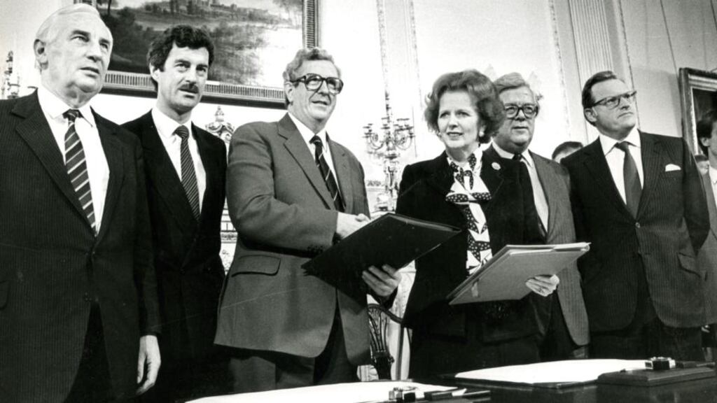 Minister for foreign affairs Peter Barry, tánaiste Dick Spring, taoiseach Garret Fitzgerald, prime minister Margaret Thatcher, British minister for foreign affairs Geoffrey Howe and Northern secretary Tom King at the signing of the Anglo-Irish Agreement.
