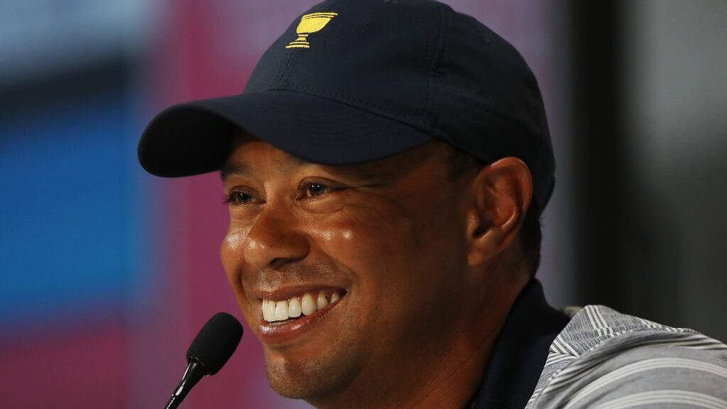USA captain’s assistant Tiger Woods talks at a Presidents Cup press conference at Liberty National Golf Club in Jersey City. Photograph: Elsa/Getty Images
