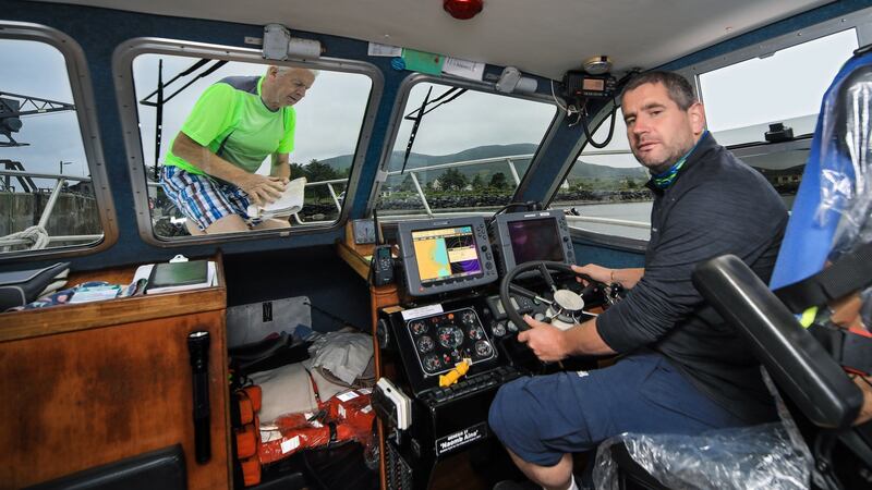 David Walsh and his father Brendan,  in their boat, entitled the Force Awakens, as they prepare to bring tourists to Skellig Michael once again. Photograph:  Valerie O’Sullivan