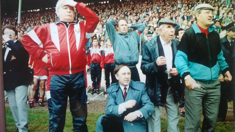 John 'Kid' Cronin (second from right) watches the action unfold from the sideline during the the 1986 All-Ireland hurling final. Photograph: Courtesy of Tracy O'Riordan