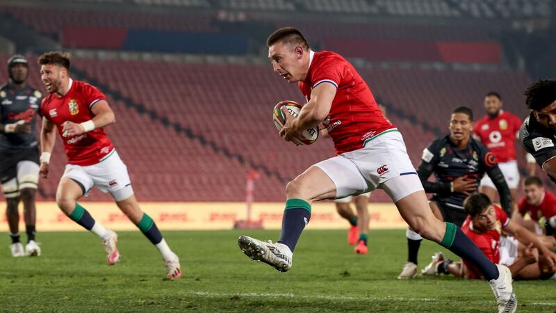 British & Irish Lions’ Josh Adams runs in the first of his hat-trick of tries against te Cell C Sharks. Photograph: Dan Sheridan/Inpho