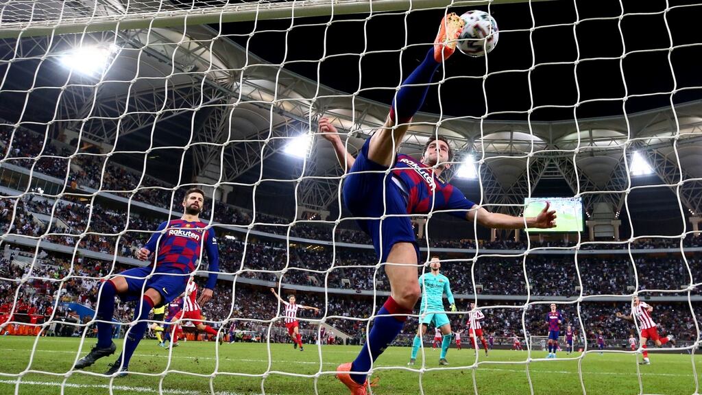 Sergi Roberto of Barcelona attempts  a spectacular clearance during the Spanish Super Cup semi-final defeat to Atletico Madrid  at King Abdullah Sports City in Jeddah, Saudi Arabia. Photograph:  Francois Nel/Getty Images