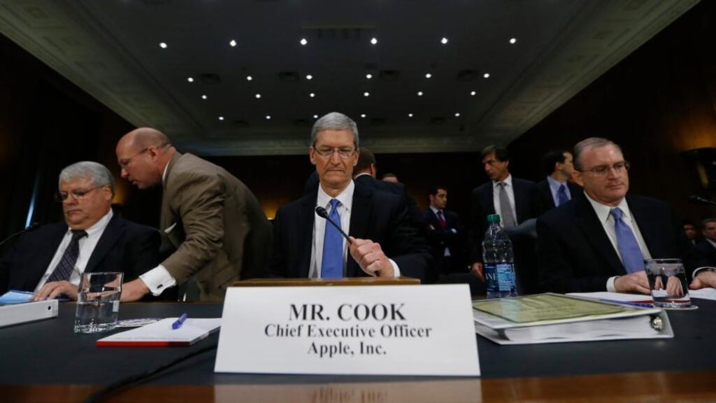 Apple chief executive Tim Cook, centre, before a Senate homeland security and governmental affairs investigations subcommittee hearing on offshore profit shifting this week. Photograph: Jason Reed/Reuters