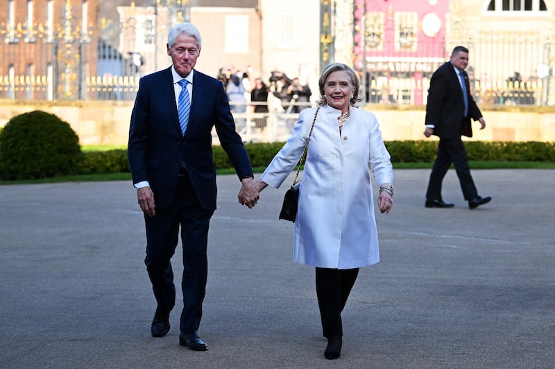 Hillary and Bill Clinton arrive for the closing gala on the final day of the conference. Photograph: Charles McQuillan/AFP via Getty Images
