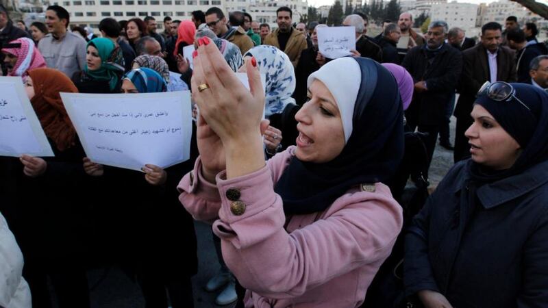 Jordanian protesters shout slogans against Israel during a protest in front of the parliament in Amman. Photograph: Muhammad Hamed/Reuters