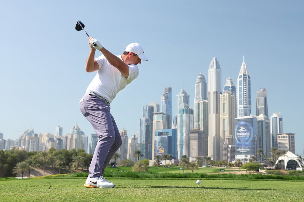 Rory McIlroy of Northern Ireland tees off on the eighth hole in Dubai. Photograph: Warren Little/Getty