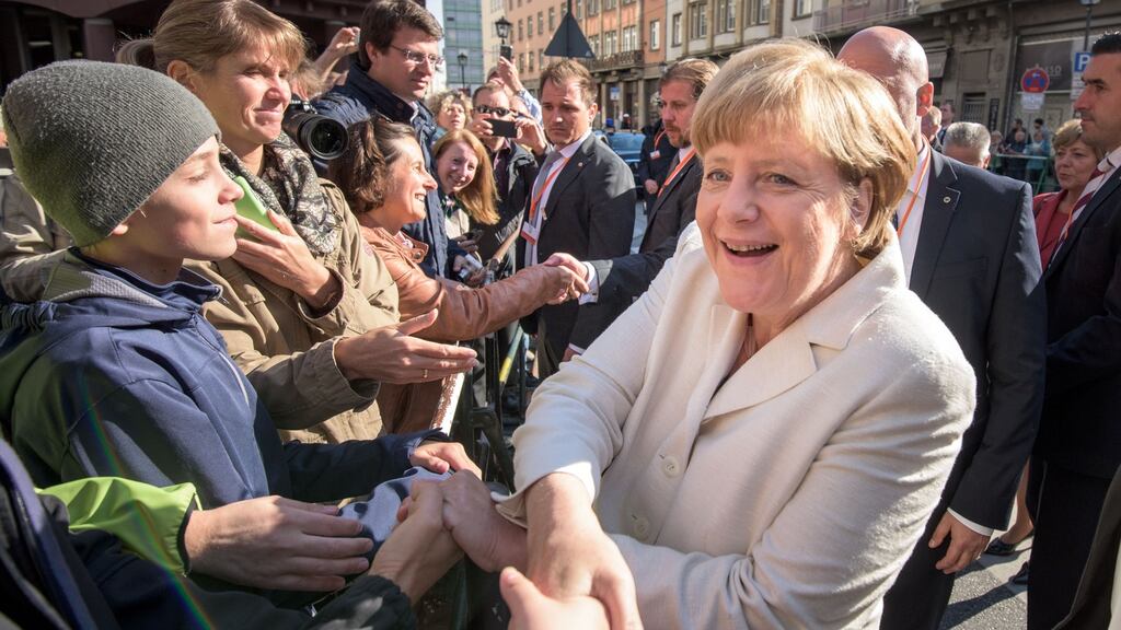 German chancellor Angela Merkel celebrates the 25th anniversary of German reunification. Political critics argue that Germany’s resources are exhausted even before one million refugees arrive this year. Photograph: Thomas Lohnes/Getty